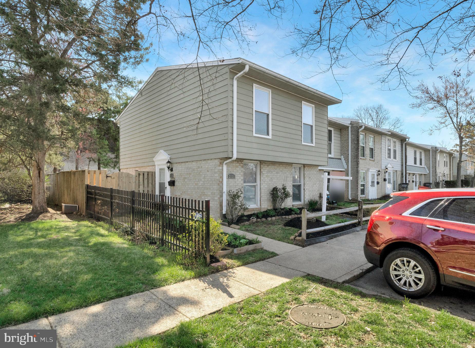 2131 Ferguson Place Herndon, VA 20170 - Photo 2 of 27 a front view of a house with garden