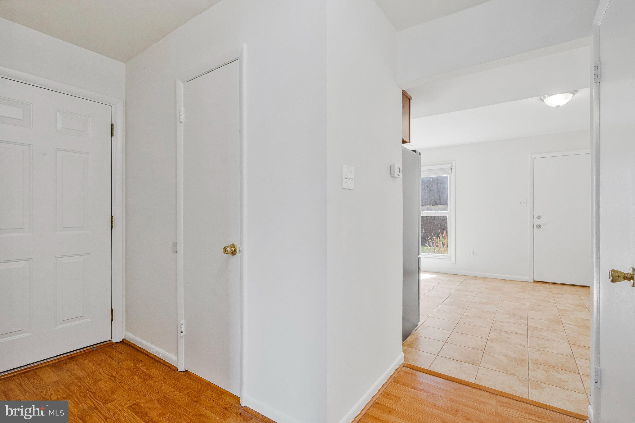 2131 Ferguson Place Herndon, VA 20170 - Photo 22 of 27 a view of a room with wooden floor and a bathroom