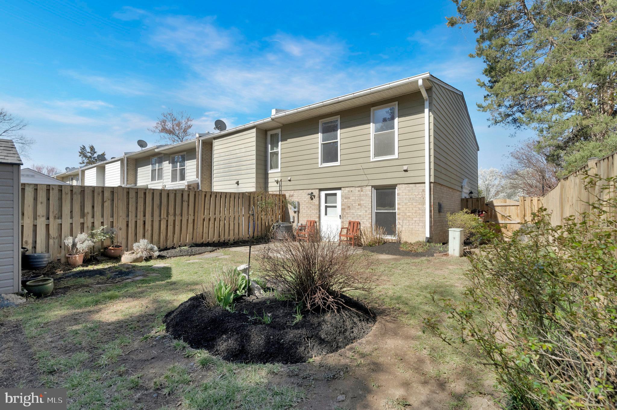 2131 Ferguson Place Herndon, VA 20170 - Photo 25 of 27 a front view of a house with garden