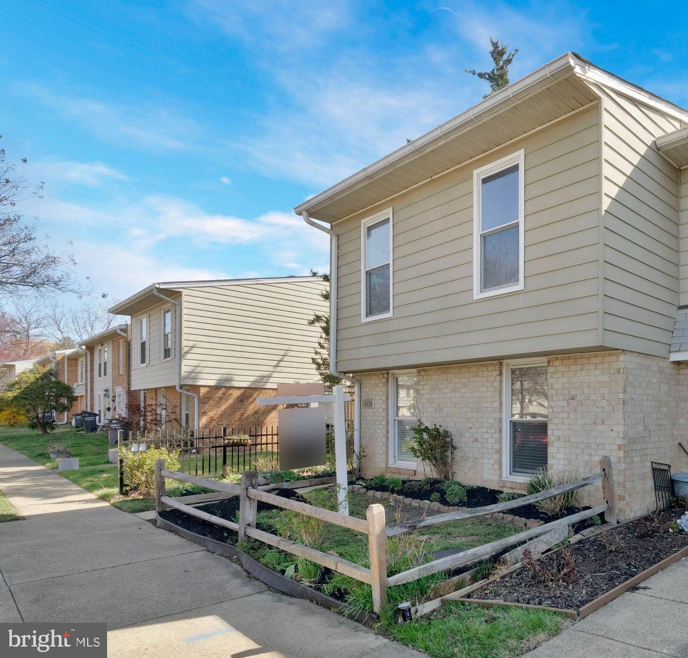 2131 Ferguson Place Herndon, VA 20170 - Photo 4 of 27 a front view of a house with garden