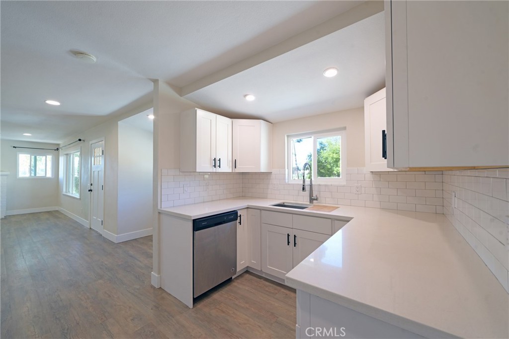 127 East College Street Fallbrook, CA 92028 - Photo 15 of 58 a kitchen with a sink cabinets and window