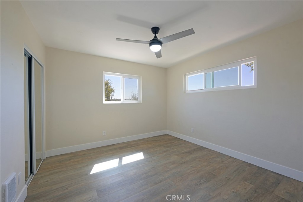 127 East College Street Fallbrook, CA 92028 - Photo 27 of 58 a view of empty room with wooden floor