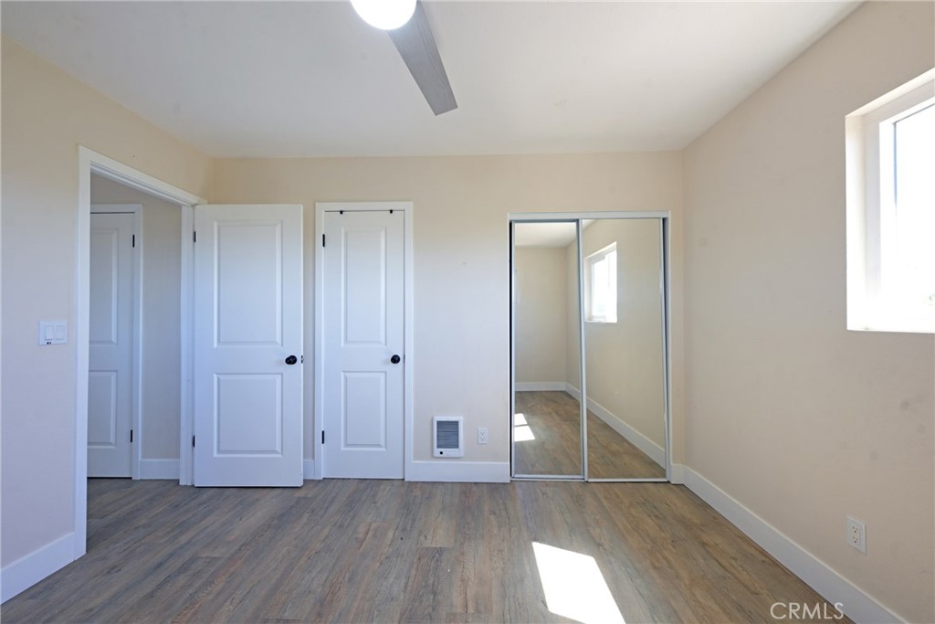 127 East College Street Fallbrook, CA 92028 - Photo 28 of 58 a view of an empty room with wooden floor and a window