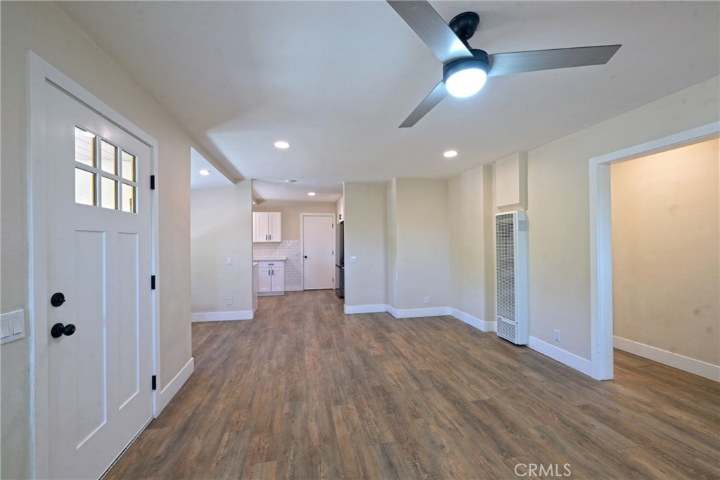 127 East College Street Fallbrook, CA 92028 - Photo 9 of 58 a view of empty room with wooden floor and fan