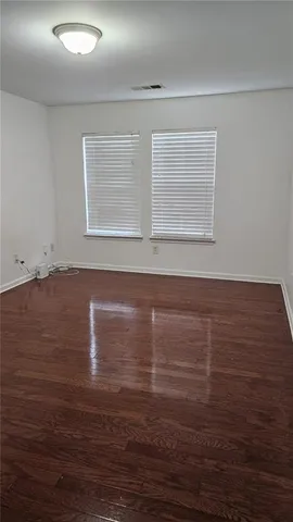 a bathroom with a shower a toilet and sink