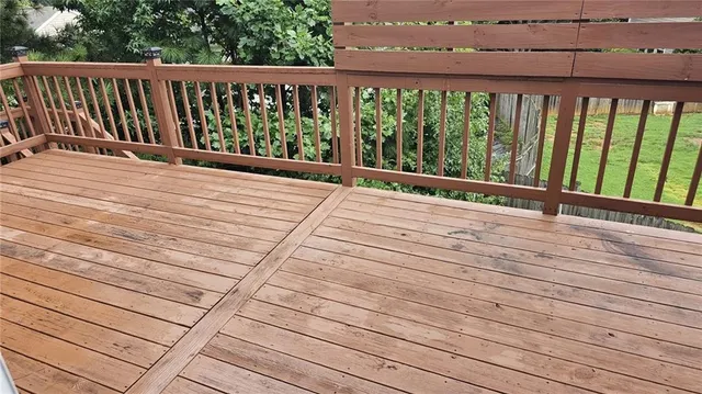 a view of porch with wooden floor