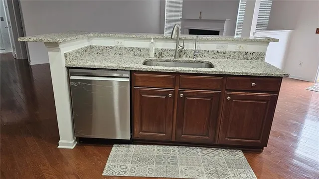 a bathroom with a shower a toilet and a sink