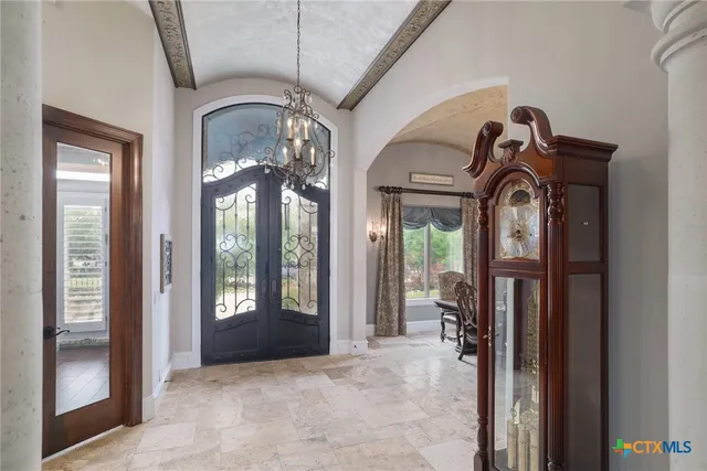 a view of a livingroom with furniture and front door