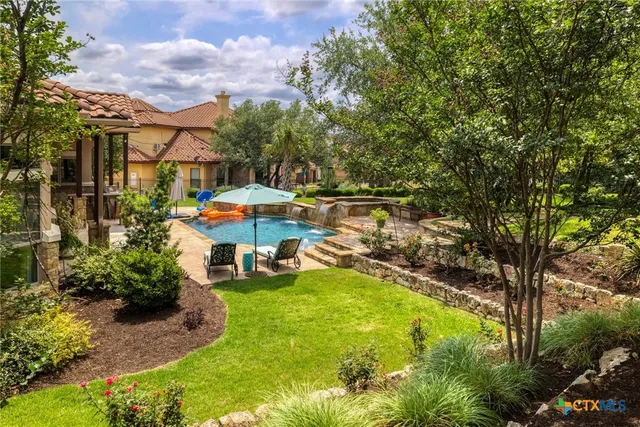 a view of a backyard with patio