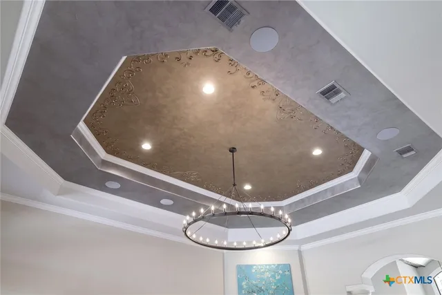a dining room with furniture and a floor to ceiling window