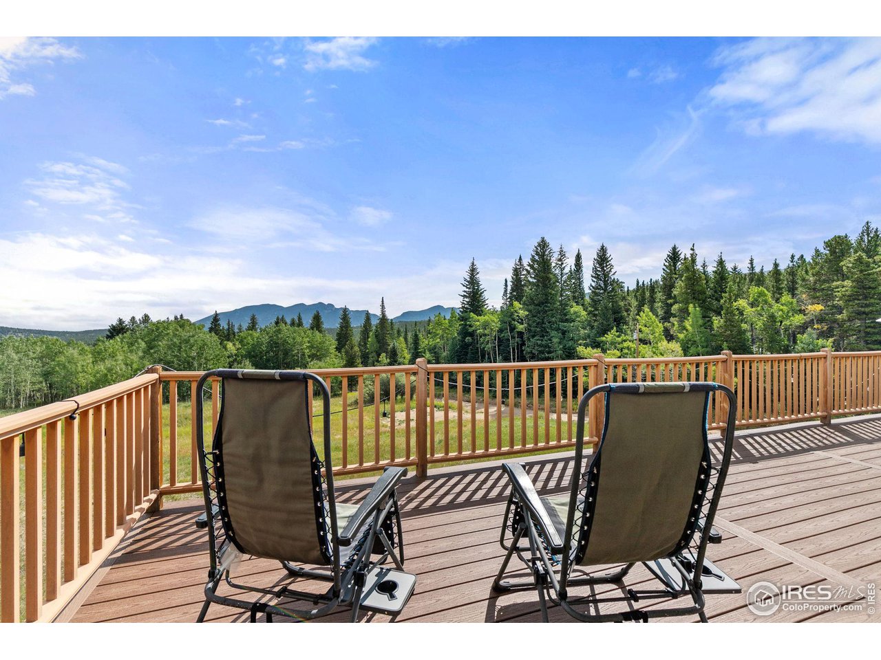 2833 Lump Gulch Road Black Hawk, CO 80422 - Photo 12 of 40 a view of a balcony with wooden floor and outdoor seating