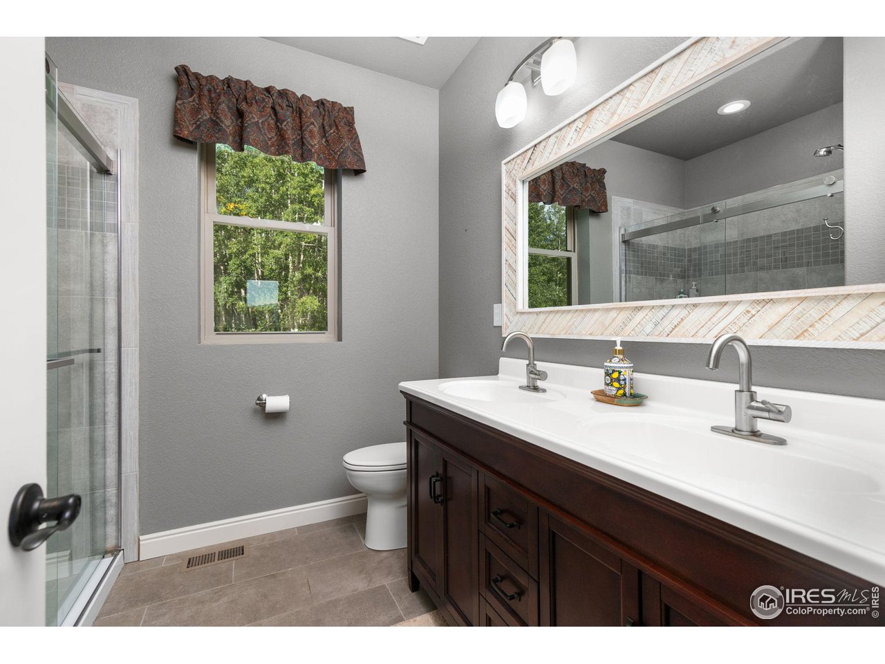 2833 Lump Gulch Road Black Hawk, CO 80422 - Photo 20 of 40 a bathroom with a sink and a mirror