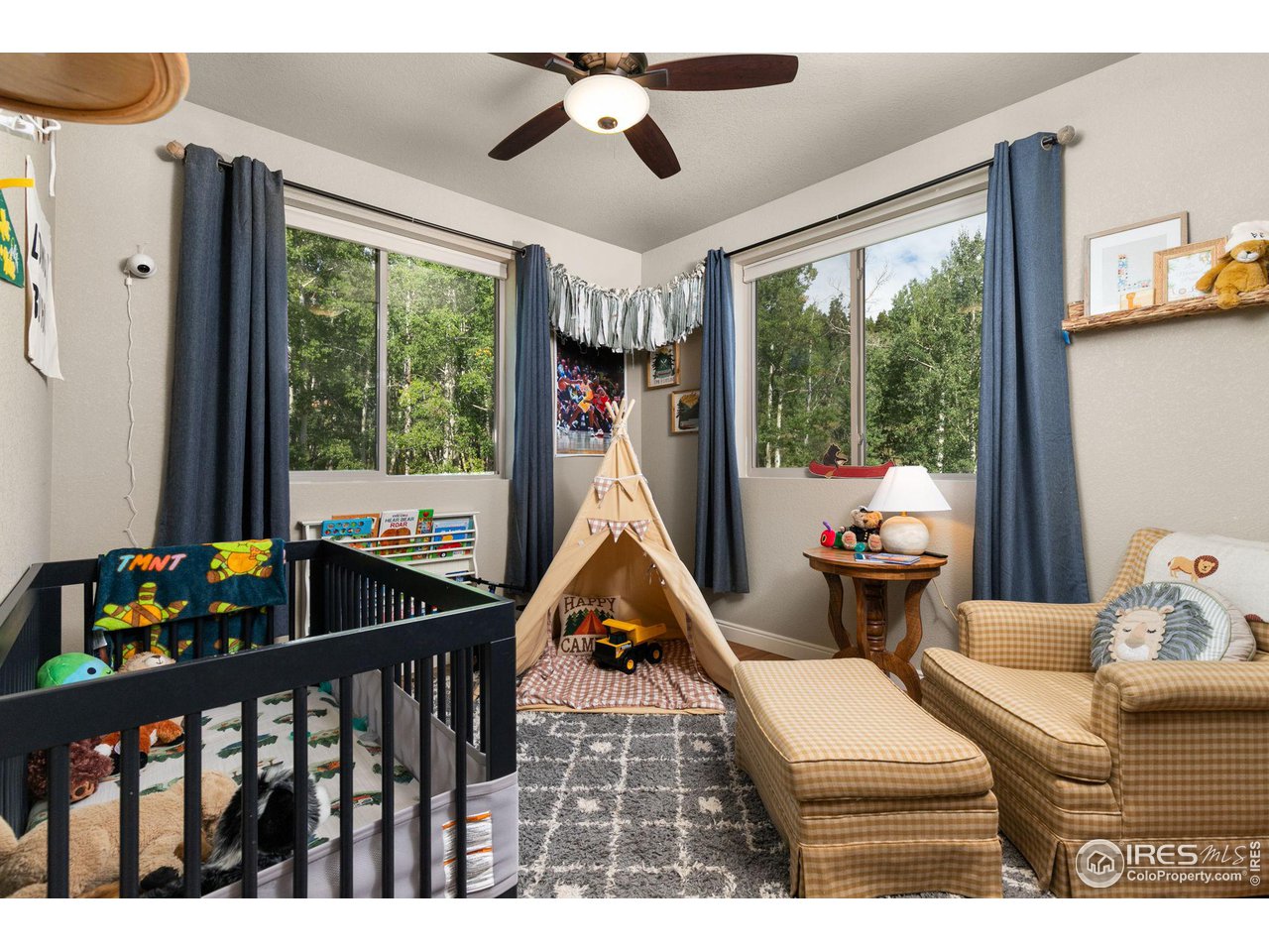 2833 Lump Gulch Road Black Hawk, CO 80422 - Photo 21 of 40 a living room with furniture and a floor to ceiling window
