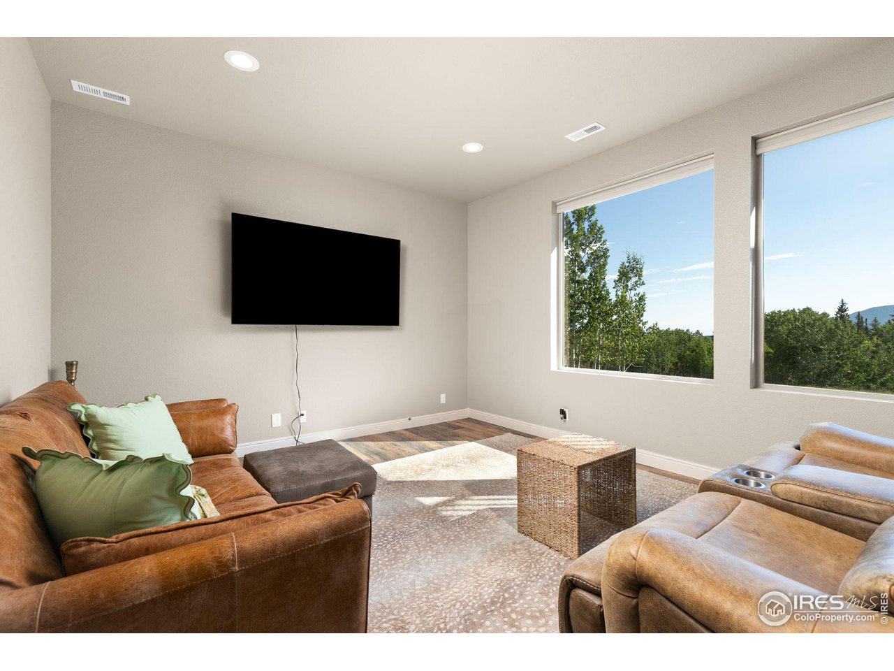 2833 Lump Gulch Road Black Hawk, CO 80422 - Photo 24 of 40 a living room with furniture and a flat screen tv