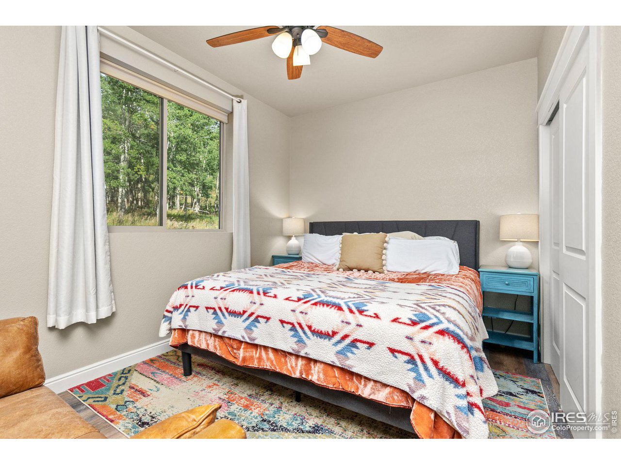 2833 Lump Gulch Road Black Hawk, CO 80422 - Photo 27 of 40 a bedroom with a bed and a window