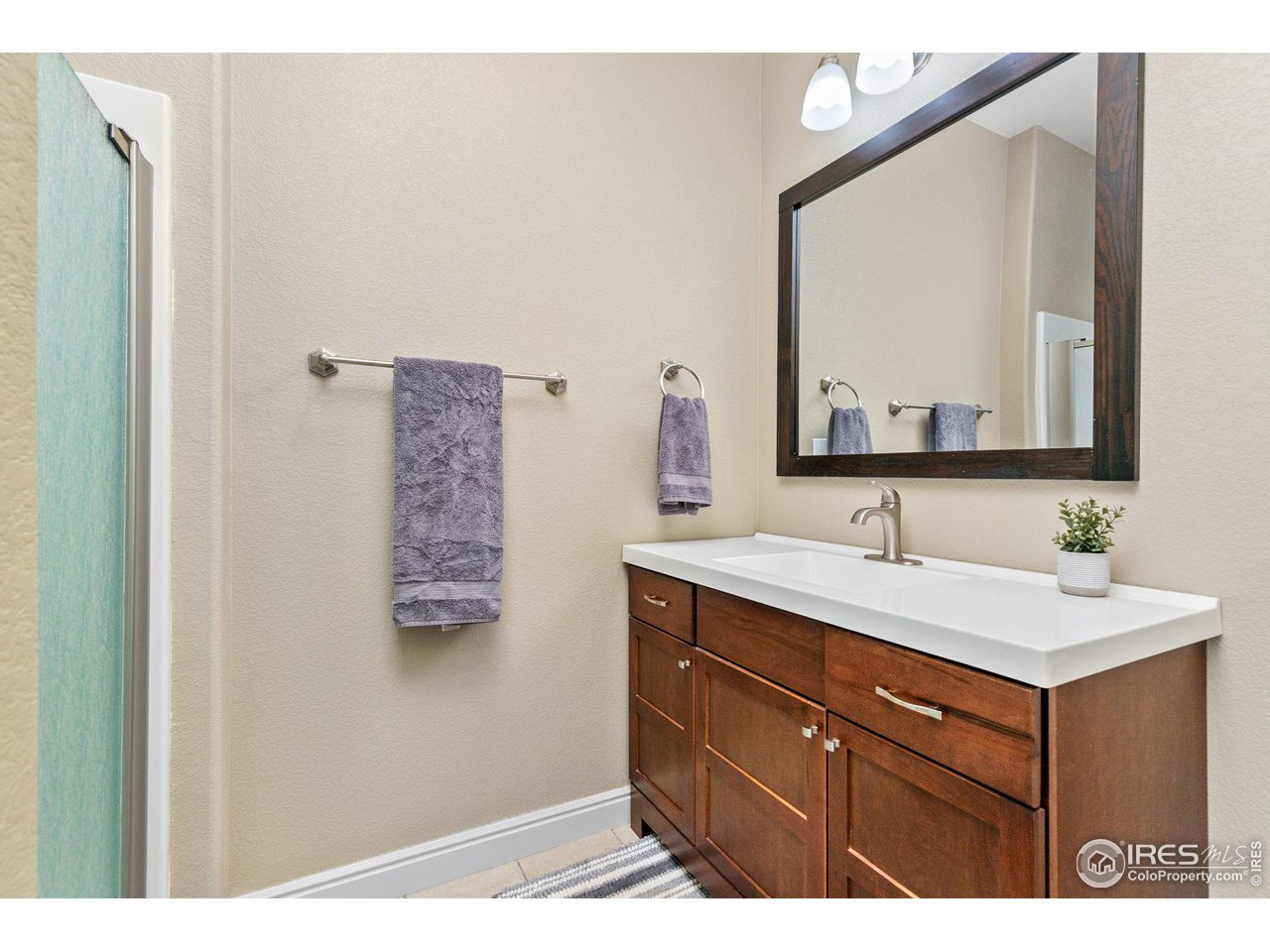 2833 Lump Gulch Road Black Hawk, CO 80422 - Photo 28 of 40 a bathroom with a sink vanity and mirror