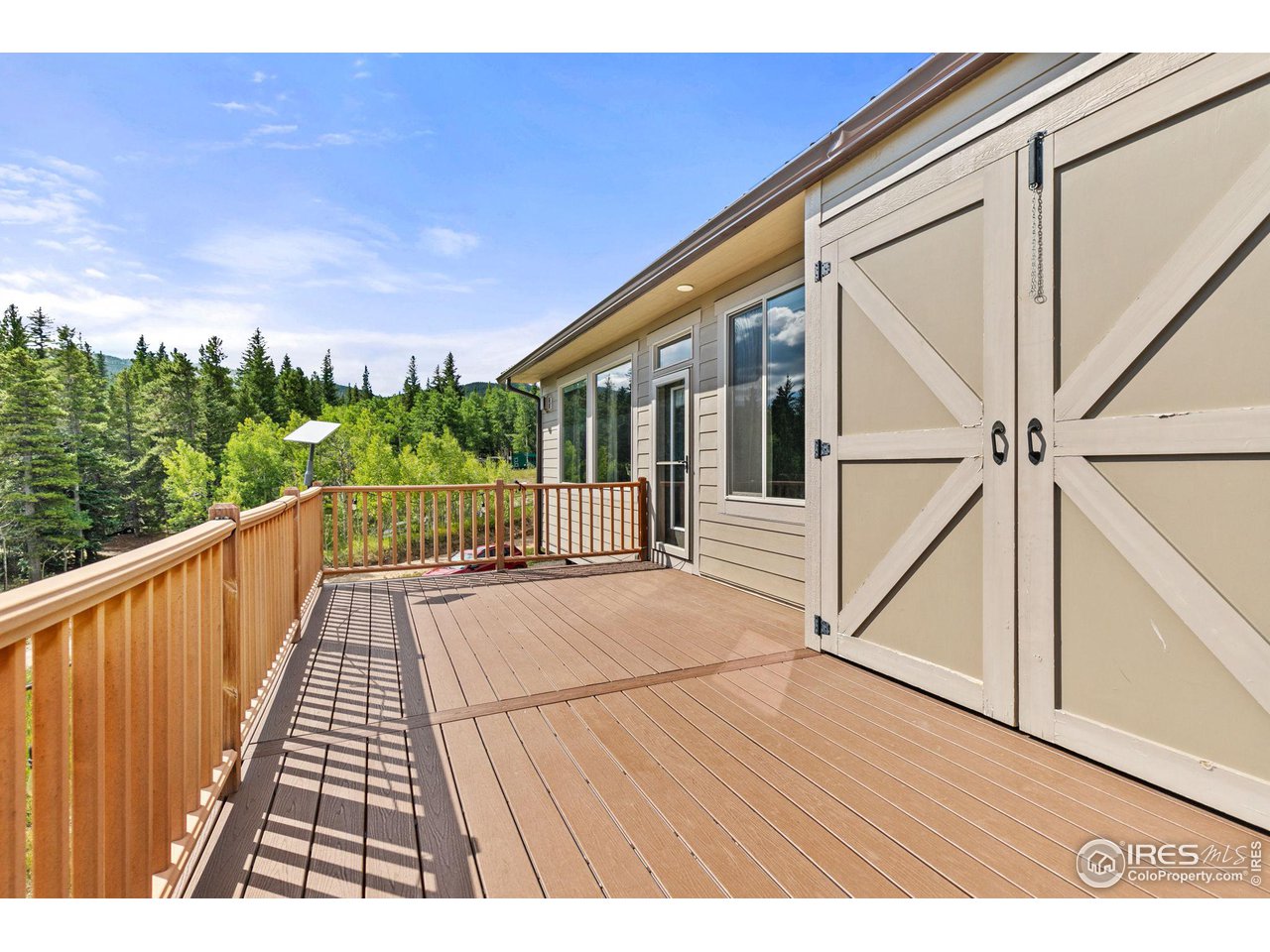 2833 Lump Gulch Road Black Hawk, CO 80422 - Photo 30 of 40 a view of balcony with wooden floor and fence