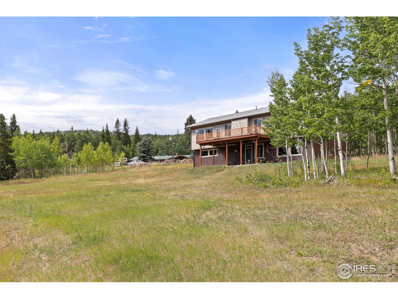 2833 Lump Gulch Road Black Hawk, CO 80422 - Photo 31 of 40 a view of an house with backyard space and balcony