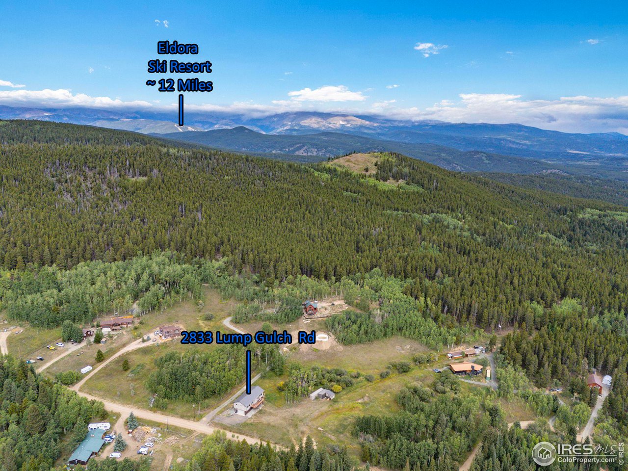 2833 Lump Gulch Road Black Hawk, CO 80422 - Photo 37 of 40 a view of a swimming pool with a yard