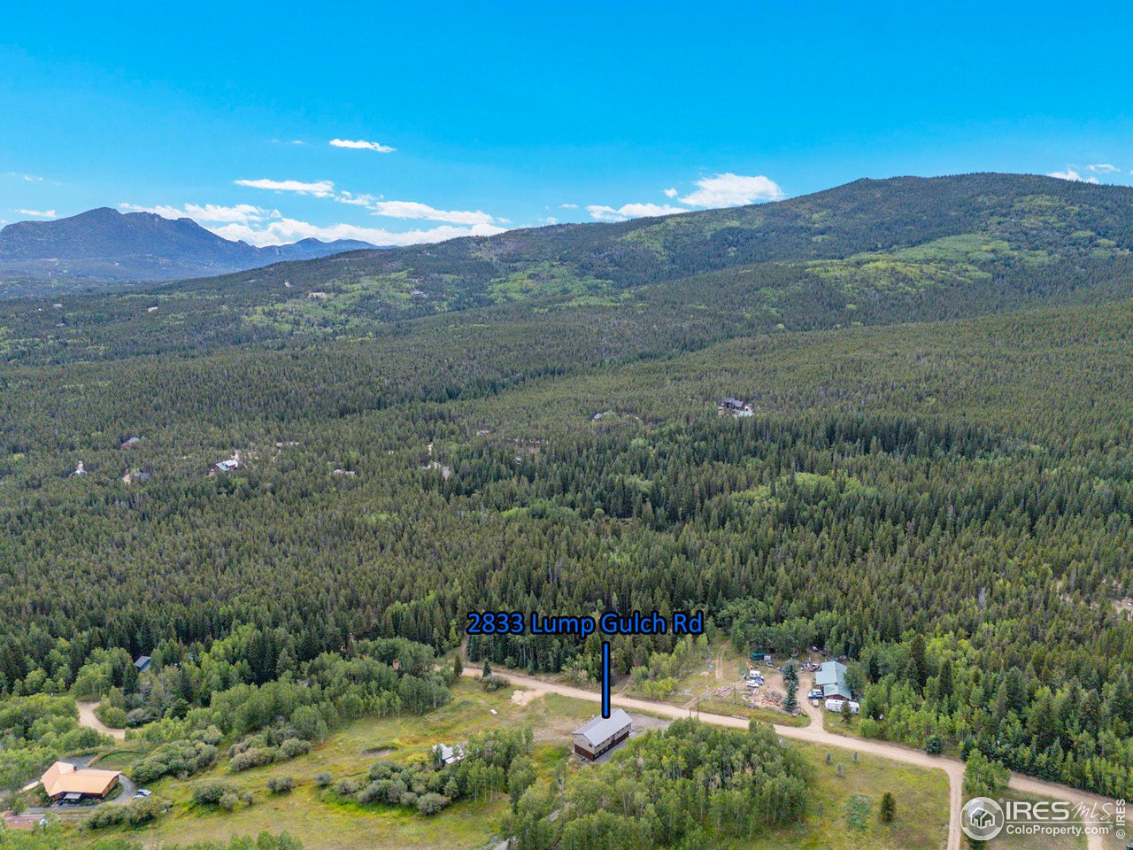 2833 Lump Gulch Road Black Hawk, CO 80422 - Photo 39 of 40 a view of a town with mountains in the background