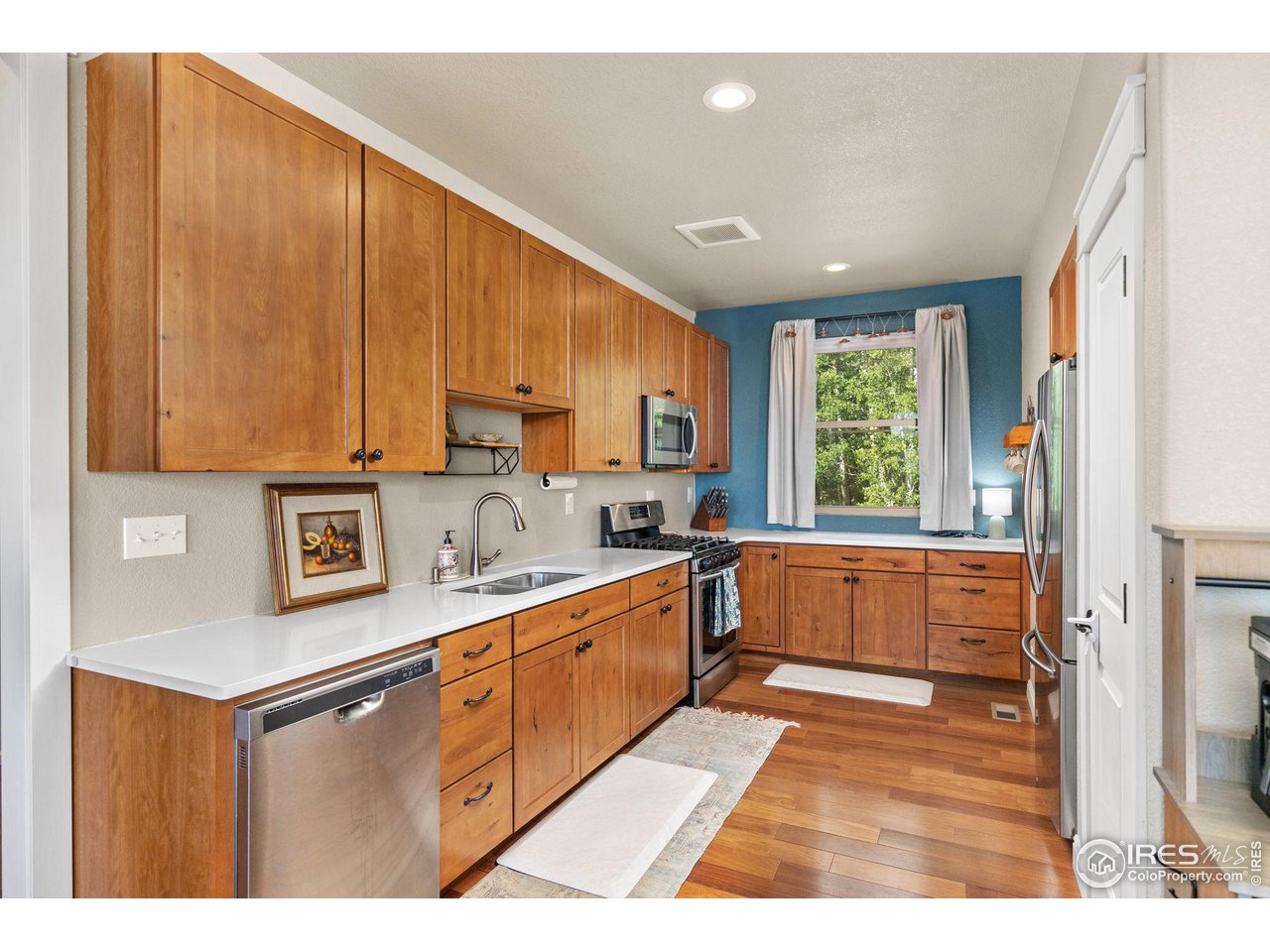 2833 Lump Gulch Road Black Hawk, CO 80422 - Photo 8 of 40 a kitchen with a sink window and cabinets