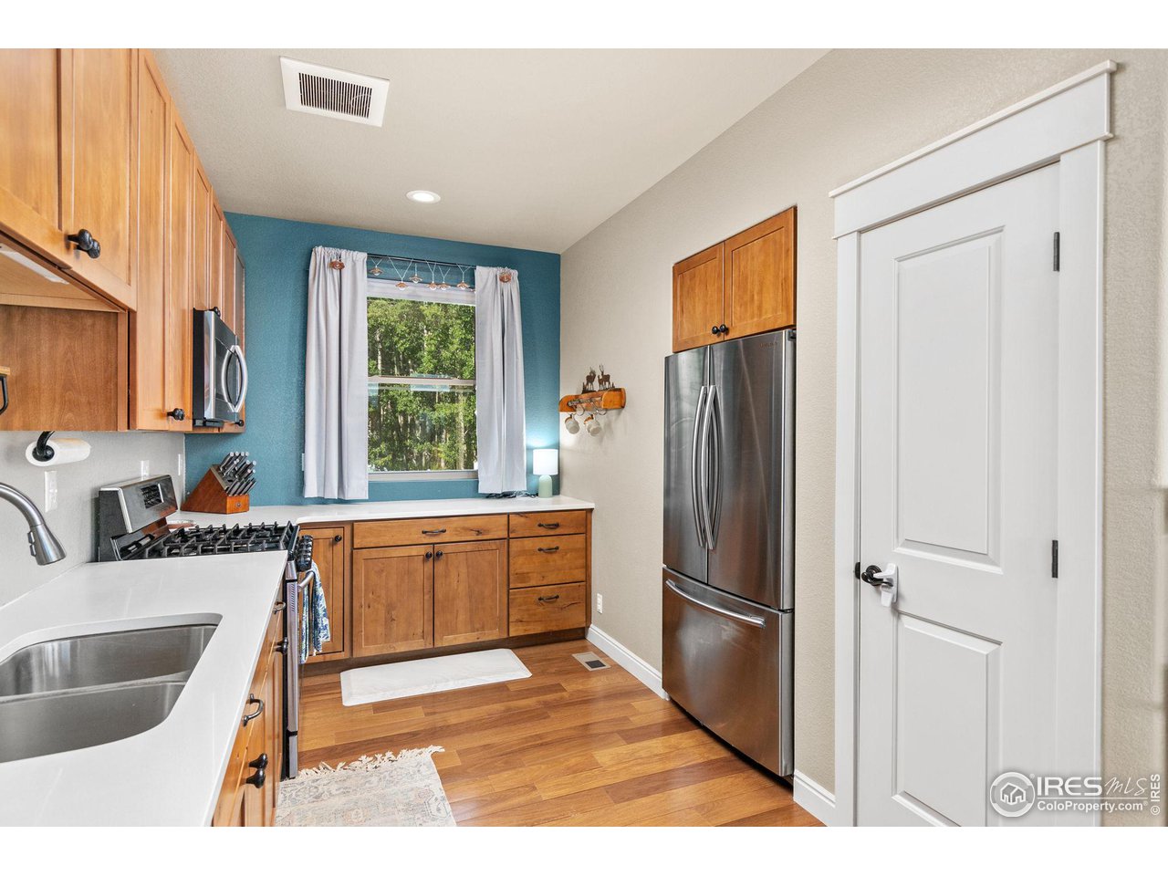 2833 Lump Gulch Road Black Hawk, CO 80422 - Photo 9 of 40 a kitchen with stainless steel appliances granite countertop a refrigerator and a sink