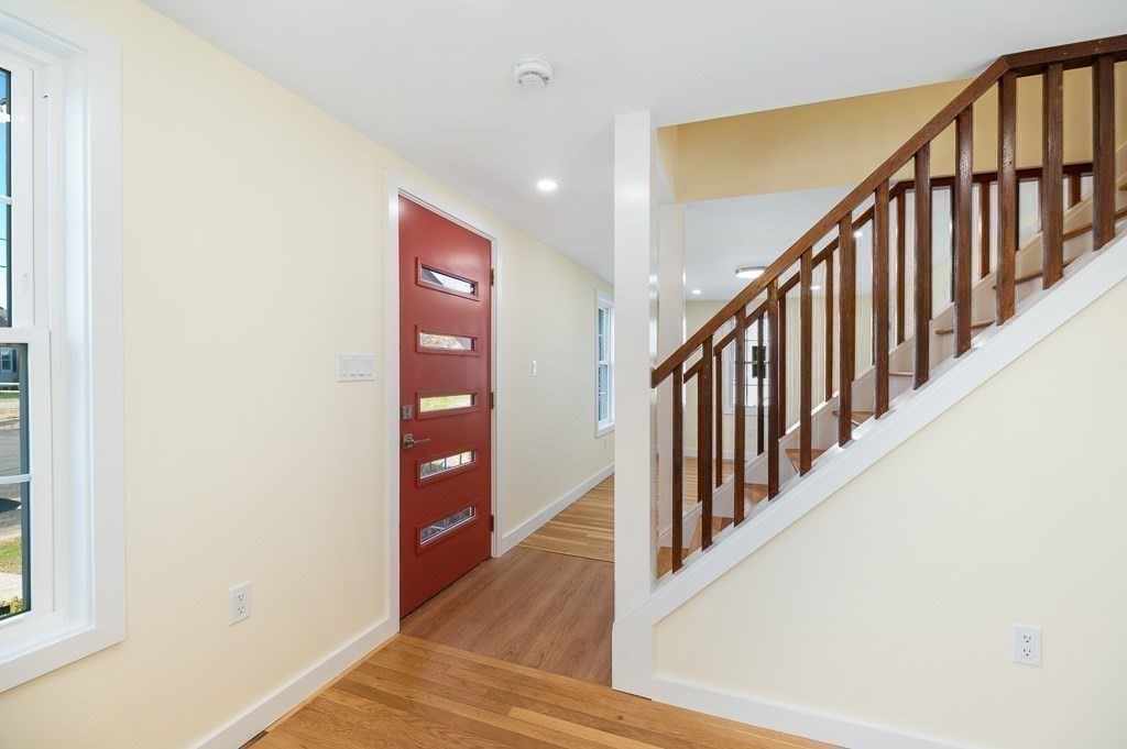 32 Lexington Drive Beverly, MA 01915 - Photo 12 of 41 a view of staircase with lots of frames on wall and a window