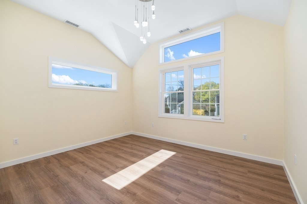 32 Lexington Drive Beverly, MA 01915 - Photo 16 of 41 wooden floor in an empty room with a window