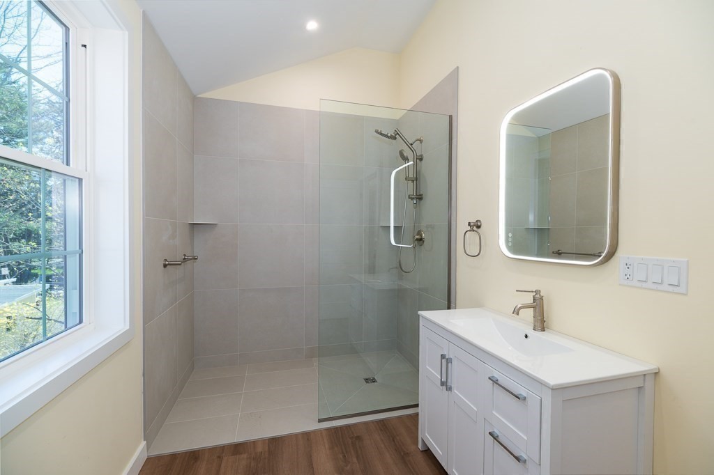 32 Lexington Drive Beverly, MA 01915 - Photo 17 of 41 a bathroom with a double vanity sink mirror and shower