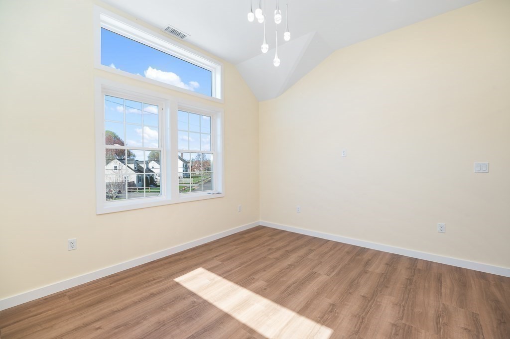 32 Lexington Drive Beverly, MA 01915 - Photo 26 of 41 an empty room with wooden floor and windows