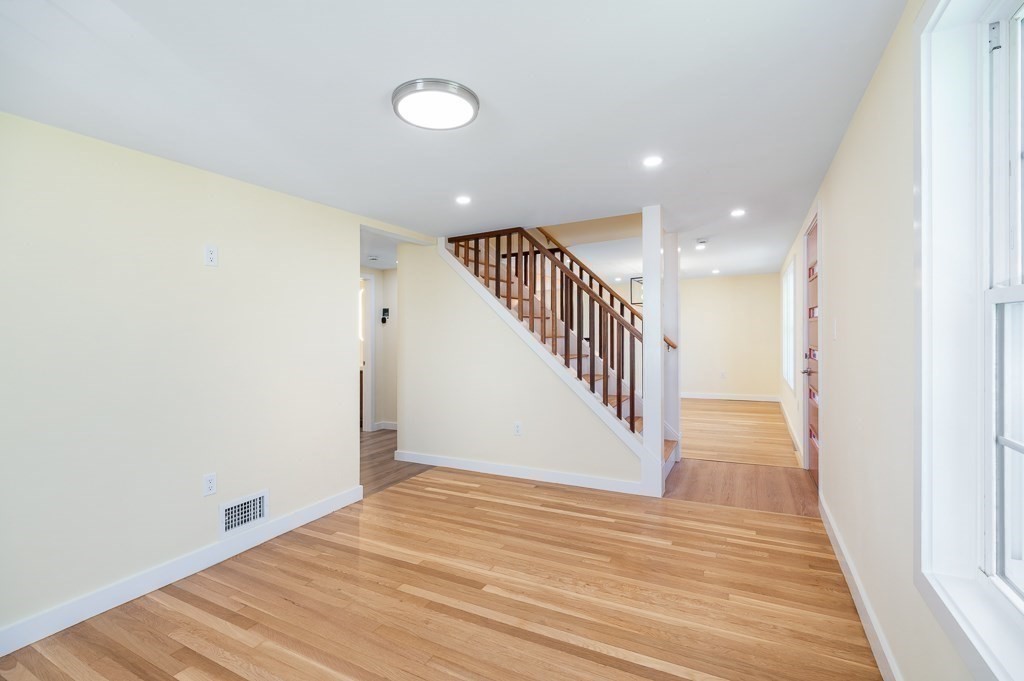 32 Lexington Drive Beverly, MA 01915 - Photo 10 of 41 a view of a hallway with wooden floor and entryway