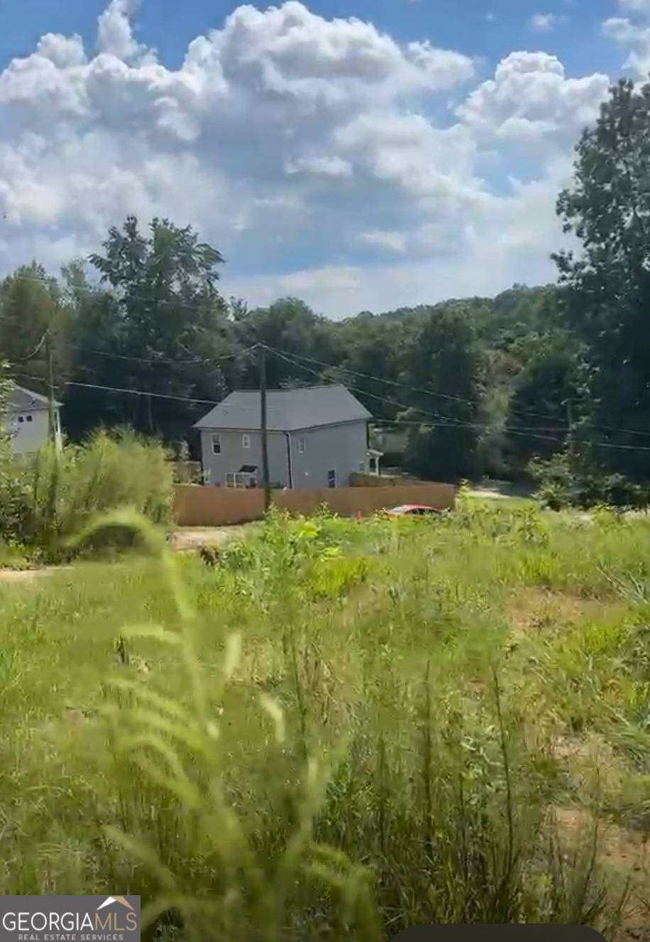 3125 Forest Circle Cumming, GA 30041 - Photo 1 of 1 a view of a lake with a yard