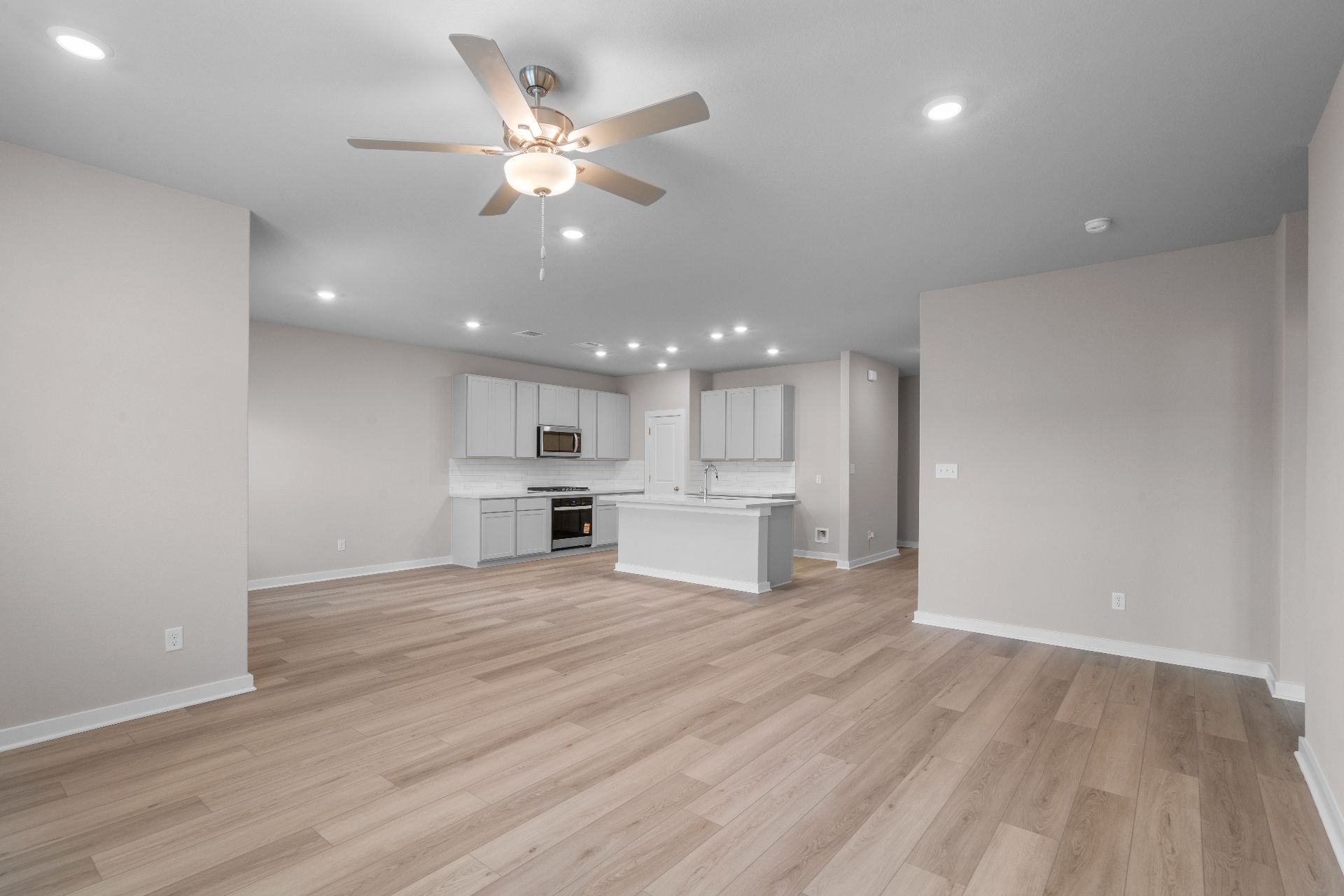 239 Red Tail Hawk Lane Cedar Creek, TX 78612 - Photo 12 of 27 From Family Room to Open Concept Kitchen