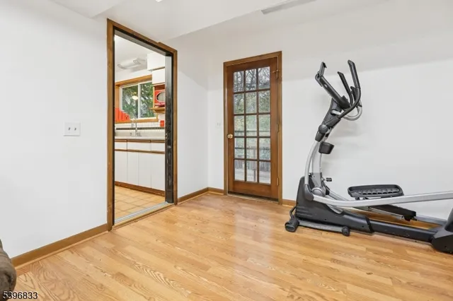 a room with gym equipment and a window