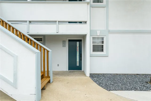 a view of a kitchen from the hallway