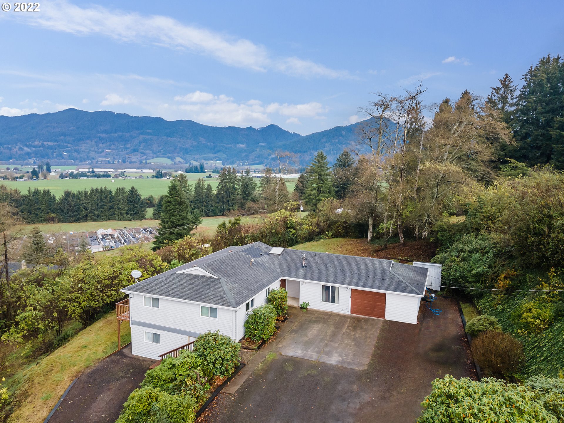 an aerial view of a house with a garden