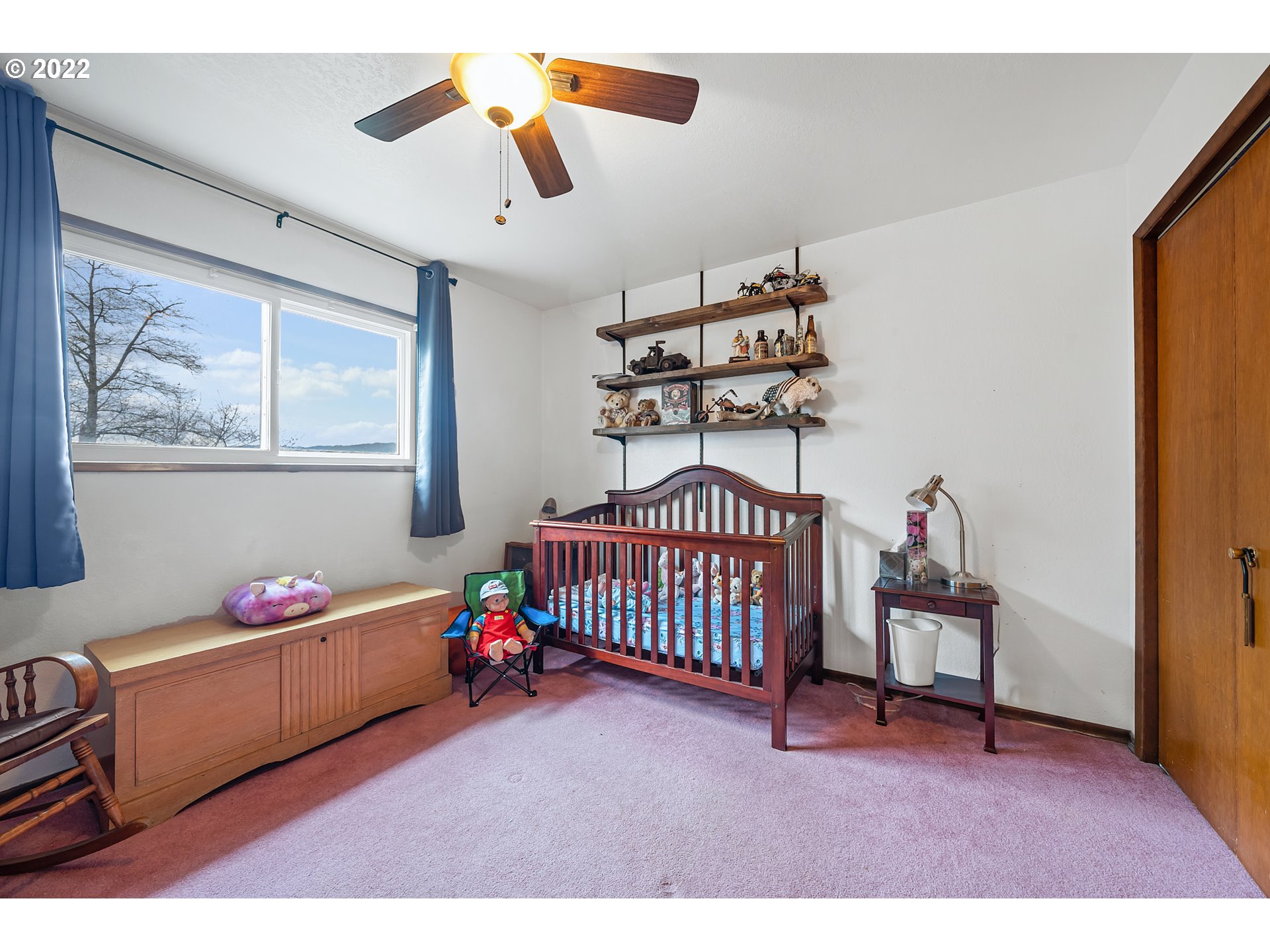 8020 Greentree Ridge Road Tillamook, OR 97141 - Photo 13 of 31 a bedroom with furniture and baby crib
