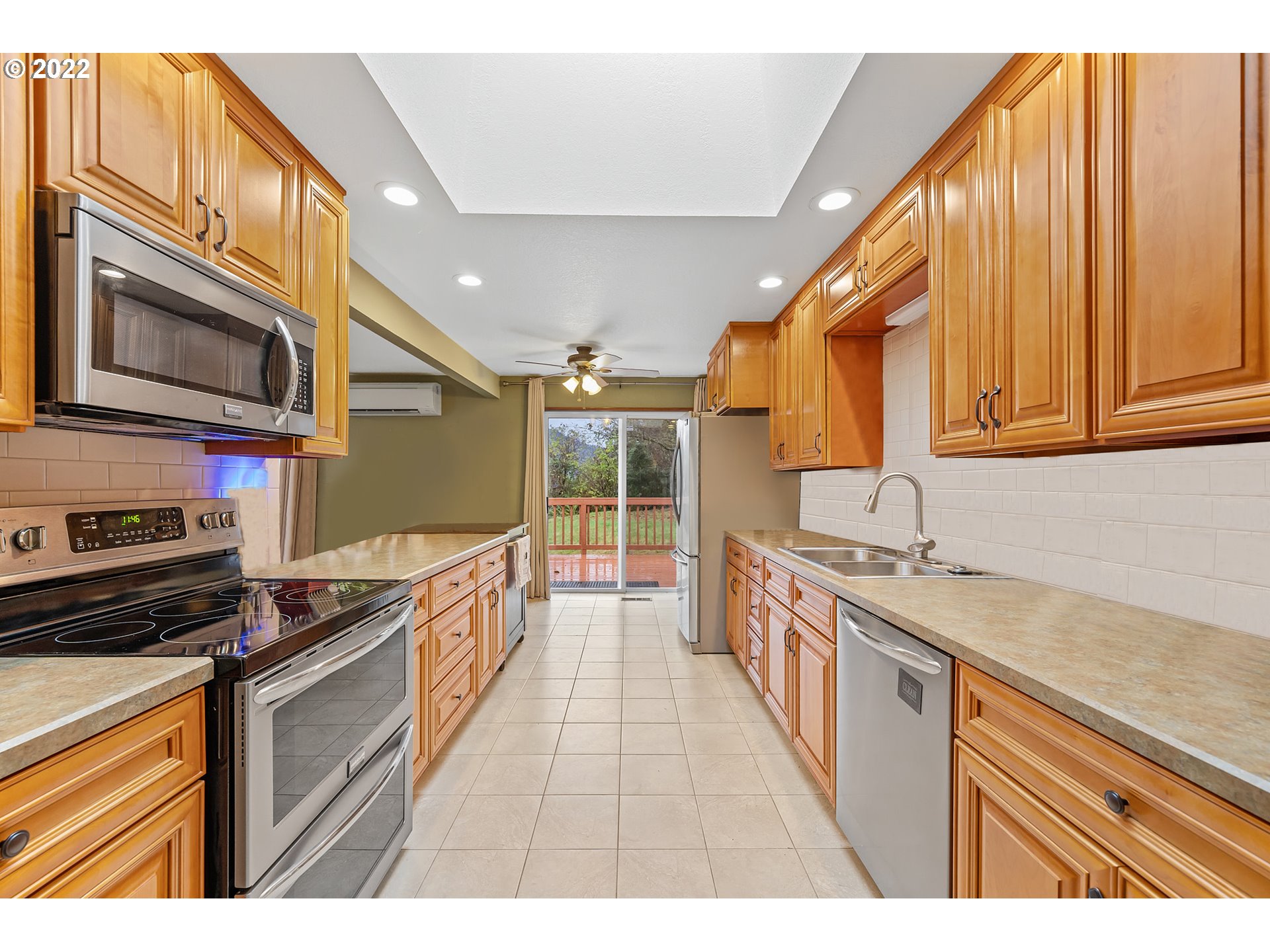 8020 Greentree Ridge Road Tillamook, OR 97141 - Photo 15 of 31 a kitchen with a sink stove and microwave