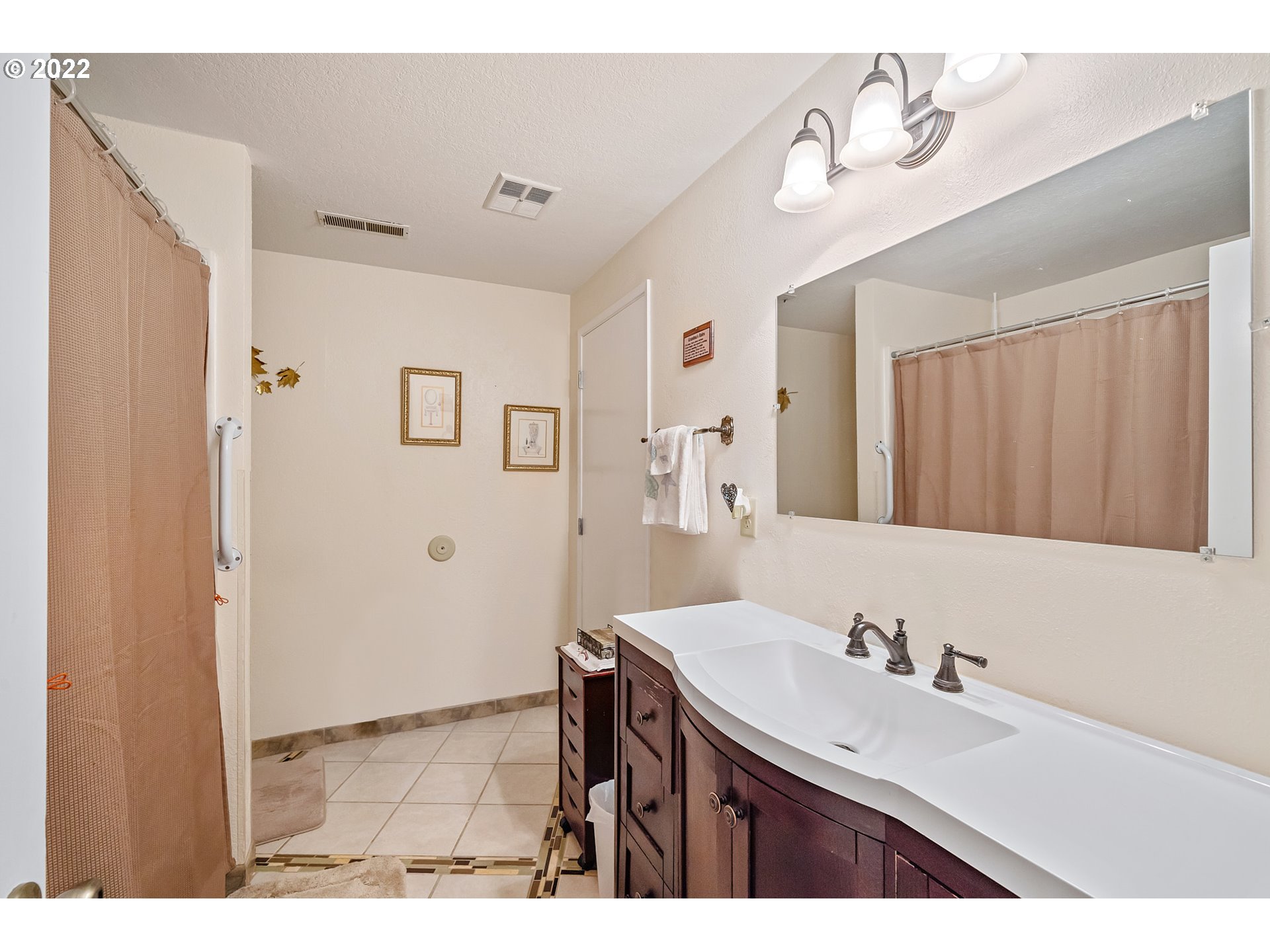 8020 Greentree Ridge Road Tillamook, OR 97141 - Photo 17 of 31 a bathroom with a sink and a mirror