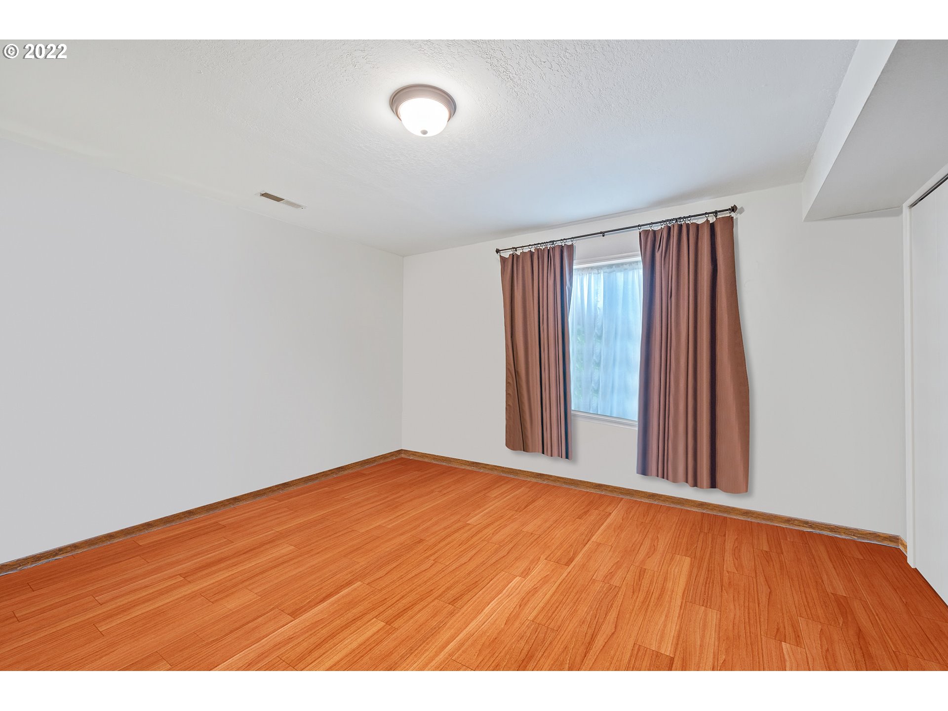 8020 Greentree Ridge Road Tillamook, OR 97141 - Photo 18 of 31 a view of an empty room with wooden floor