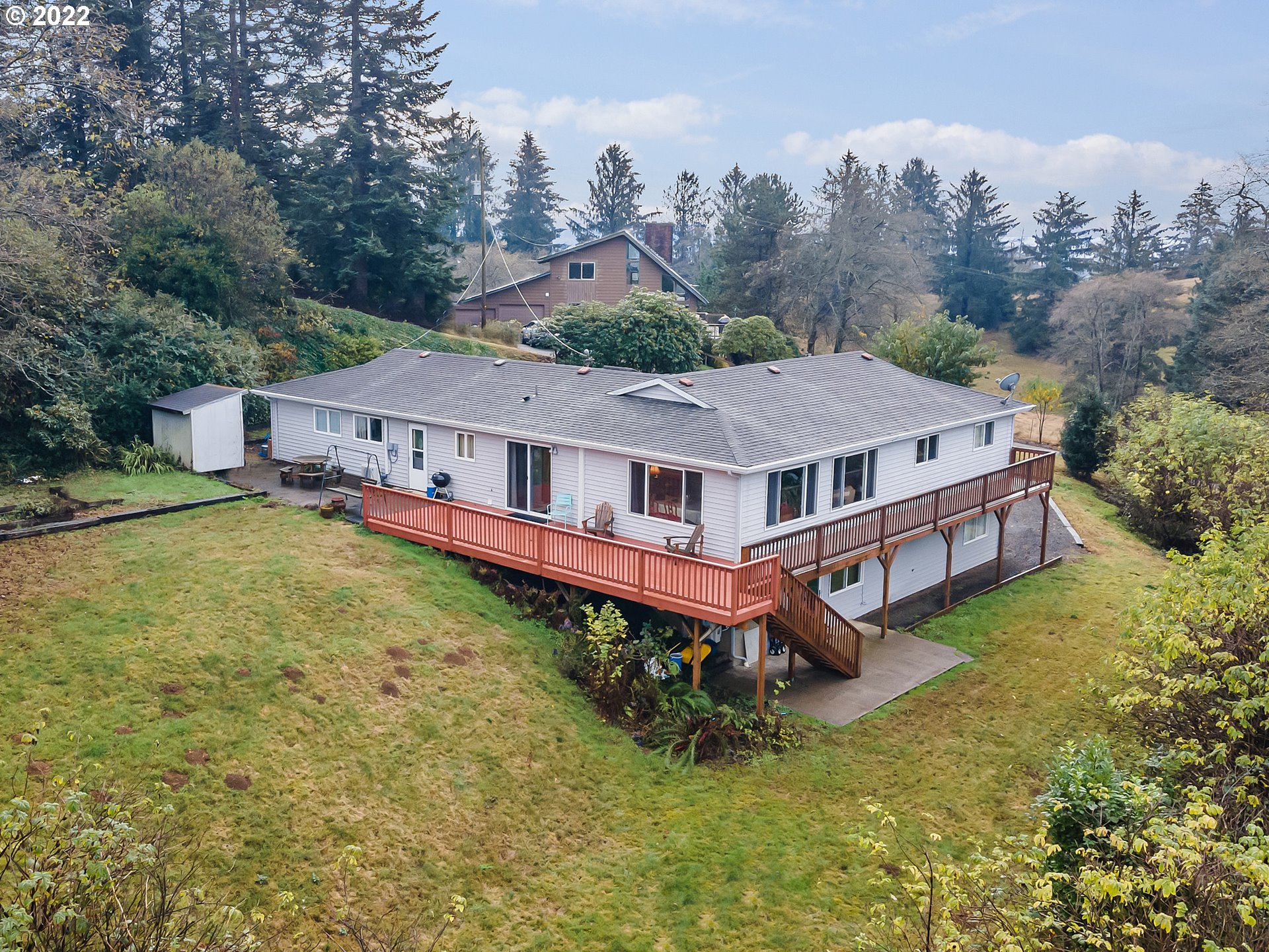 8020 Greentree Ridge Road Tillamook, OR 97141 - Photo 5 of 31 an aerial view of a house with swimming pool and big yard