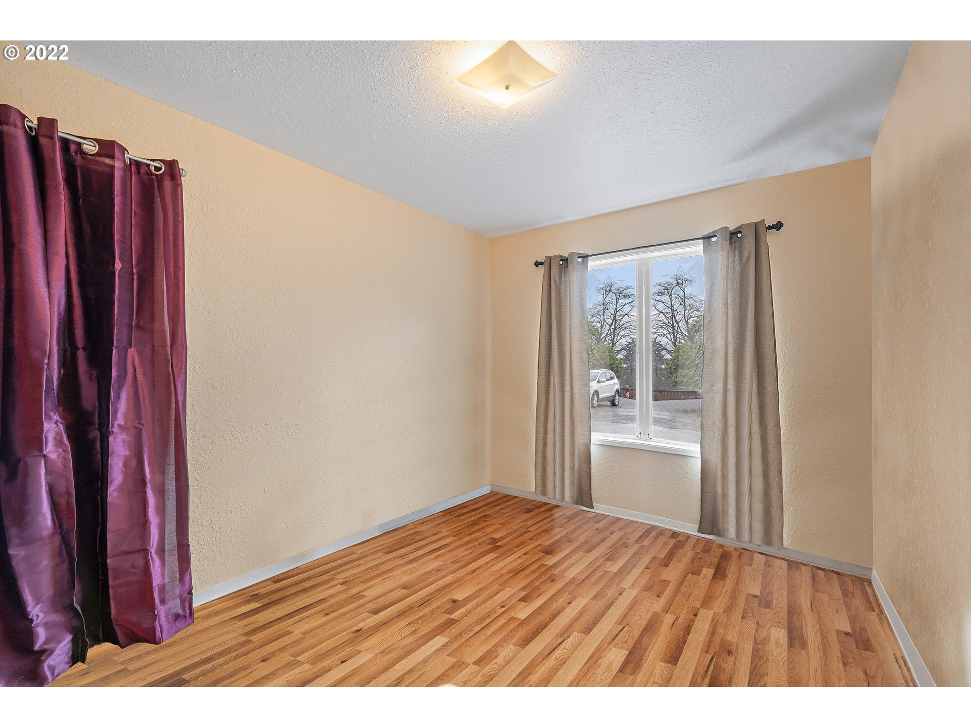 8020 Greentree Ridge Road Tillamook, OR 97141 - Photo 8 of 31 a room with a bed and wooden floor
