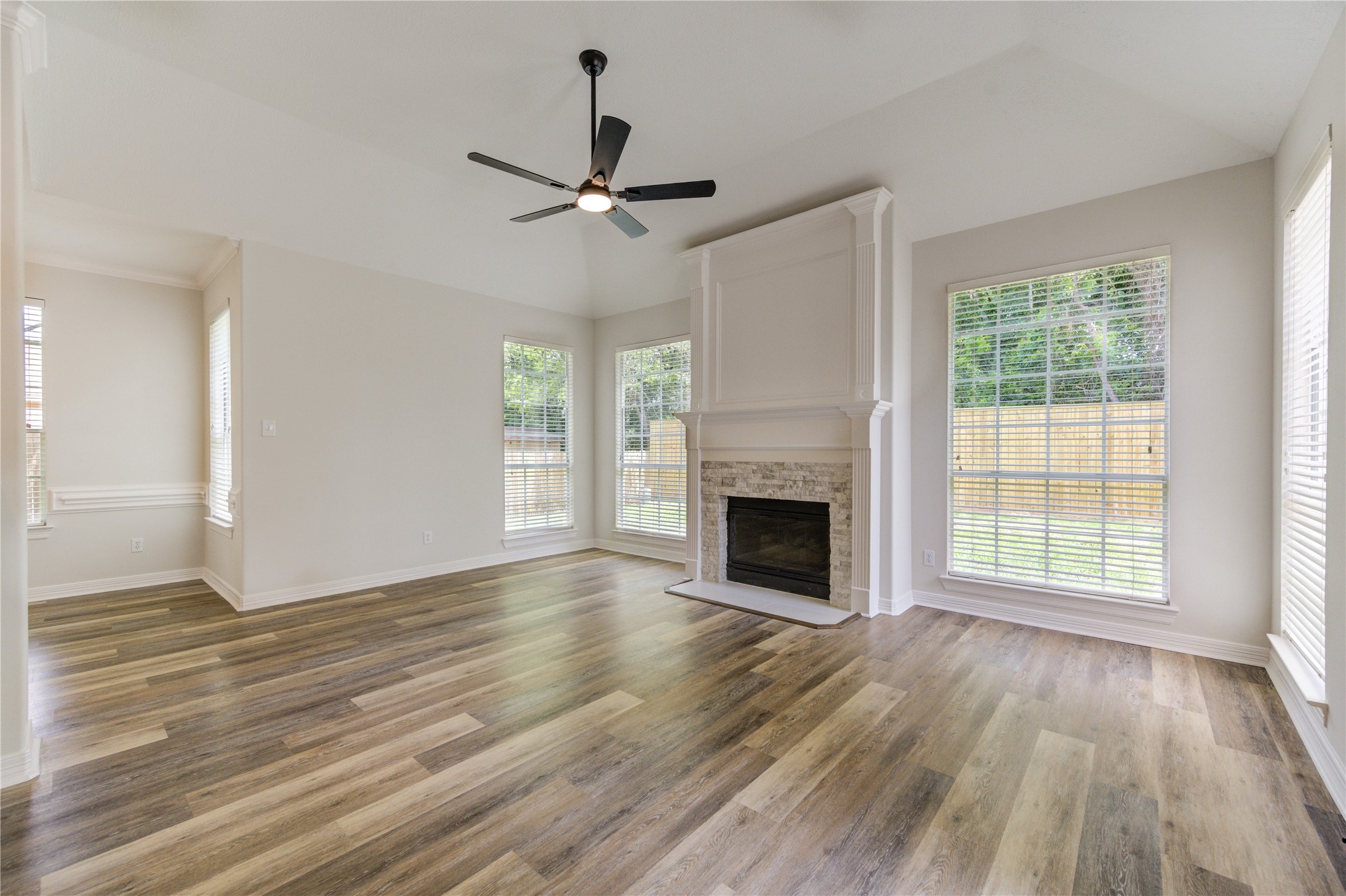 17318 Bonnard Circle Spring, TX 77379 - Photo 14 of 45 The informal areas include a large family room, breakfast area, and island kitchen! The family room has a beautiful gas fireplace with new ledger tile surround, and a new modern ceiling fan.