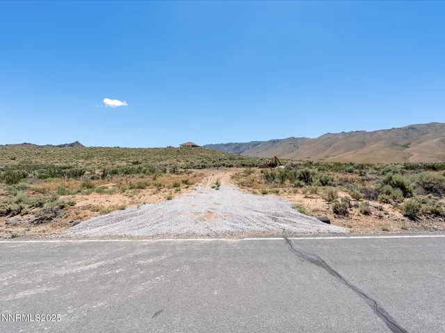a view of a road with a ocean view