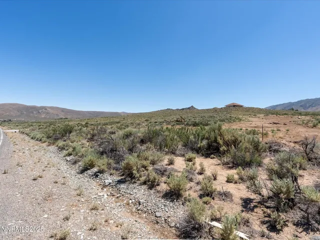a view of a dry yard with mountain