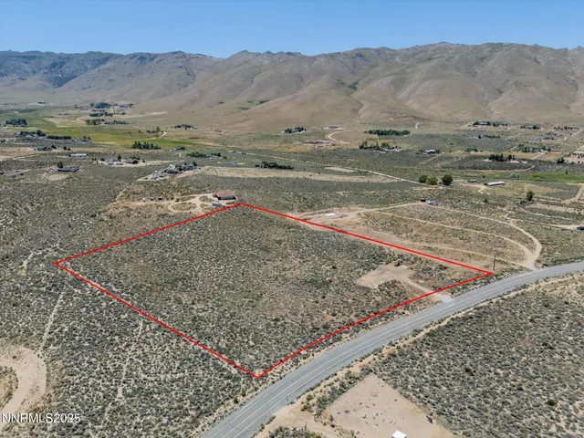a view of a dry yard with mountain