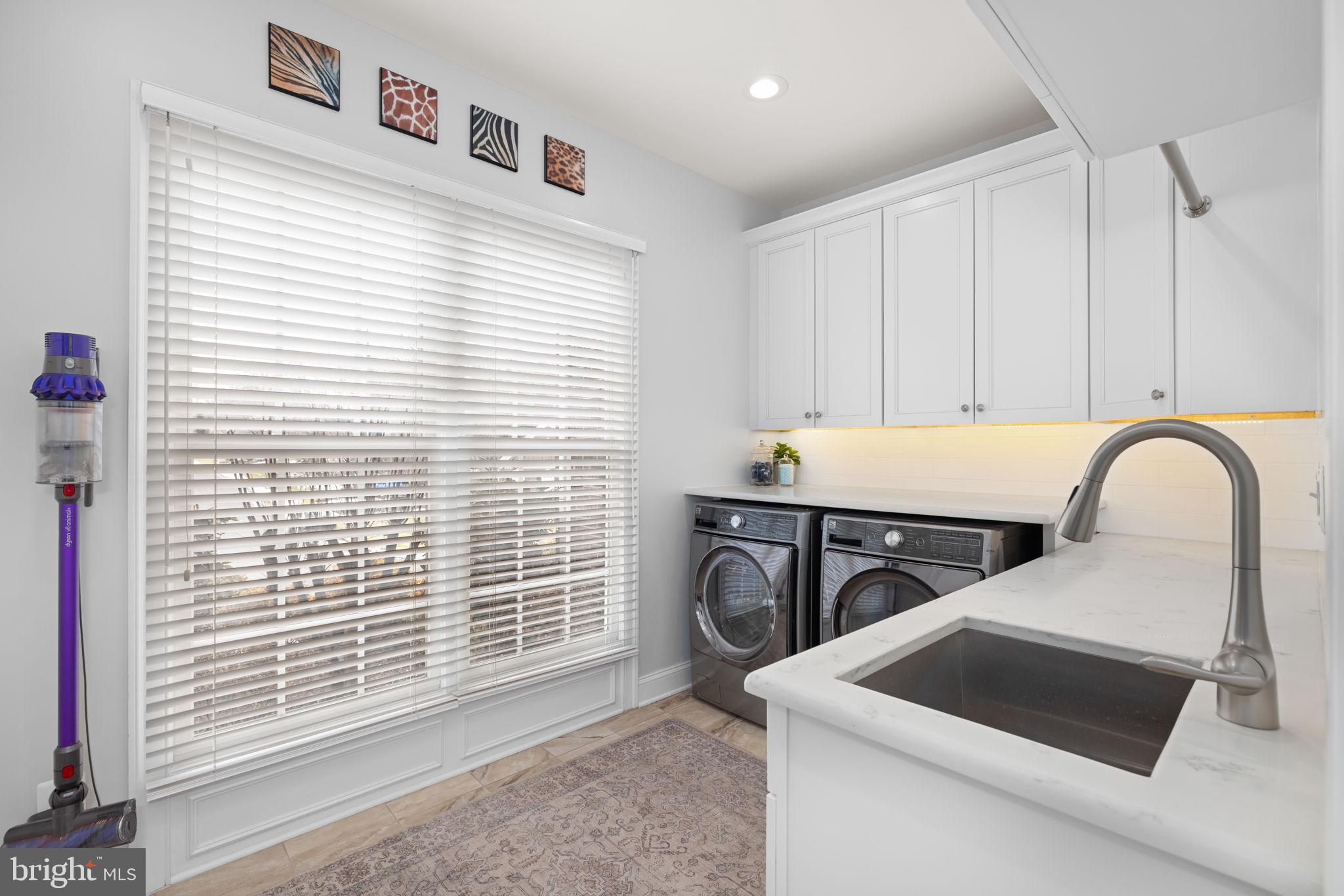 3257 Pony Ridge Way Oakton, VA 22124 - Photo 24 of 67 Main level laundry with cabinetry and sink