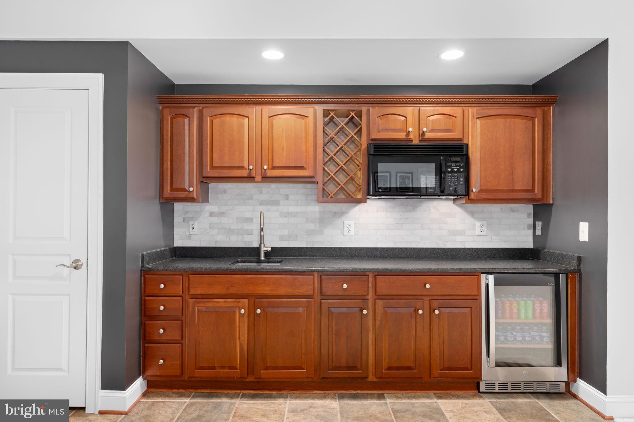 3257 Pony Ridge Way Oakton, VA 22124 - Photo 43 of 67 Lower level bar area with Sub-Zero mini fridge