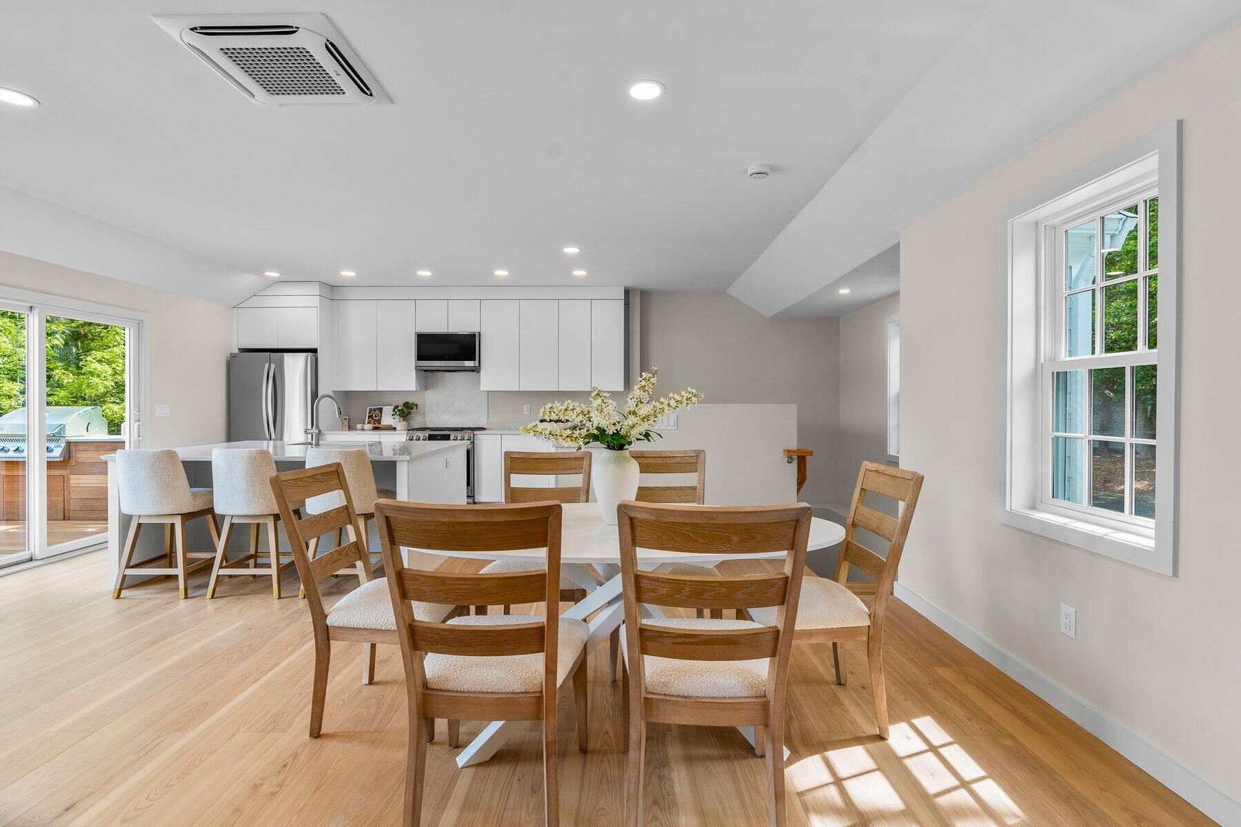 162 Main Street Osterville, MA 02655 - Photo 8 of 50 a view of a dining room with furniture and wooden floor