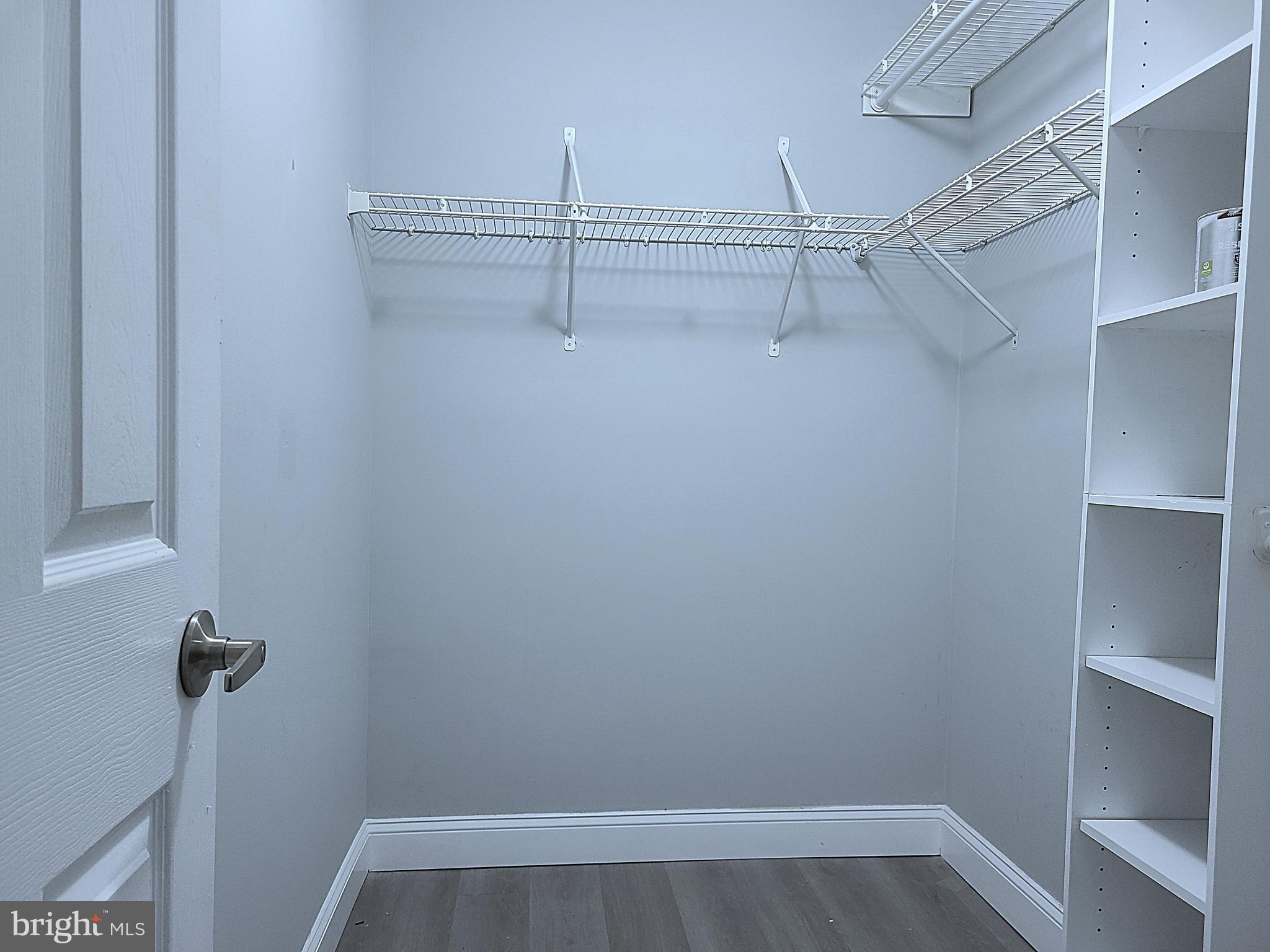 1049 Gardenview Loop, Unit 302 Woodbridge, VA 22191 - Photo 13 of 21 Walk-in closet in primary bedroom